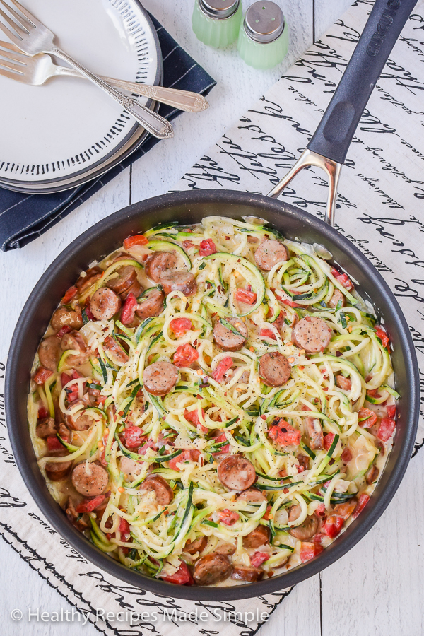 Overhead shot of a pan of sausage zucchini alfredo in a large pan.