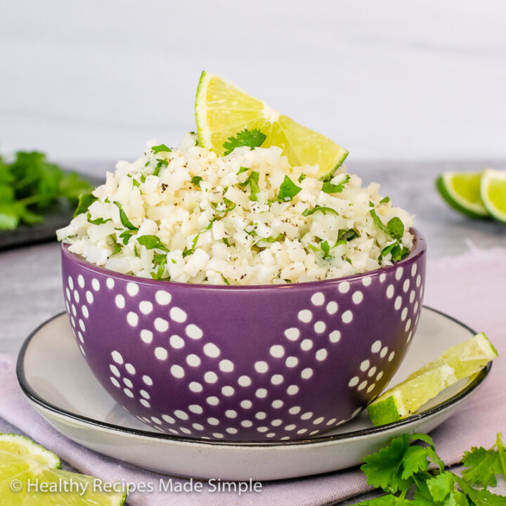 Square picture of a purple bowl of Cilantro Lime Cauliflower Rice.