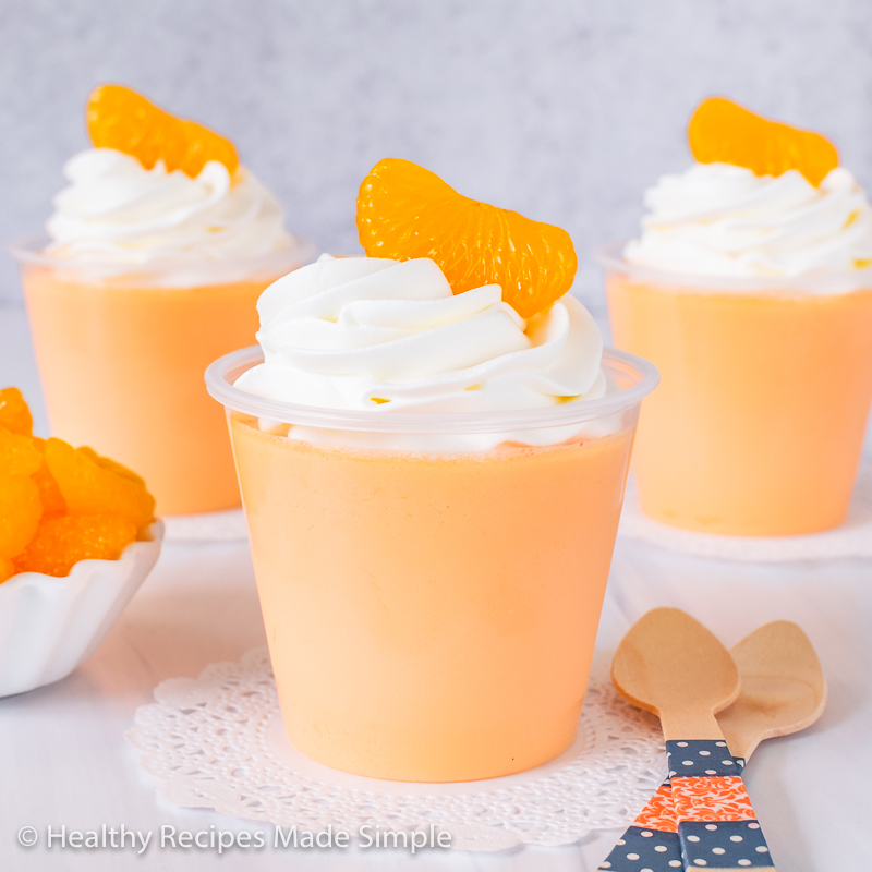 Square image of 3 orange creamsicle protein Jello cups.