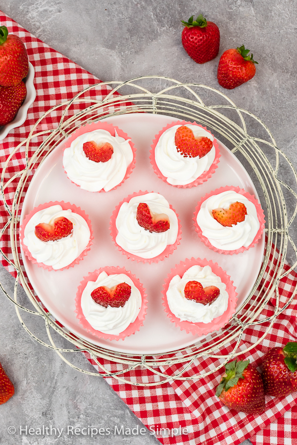 An overhead picture of a plate of creamy strawberry yogurt bites.