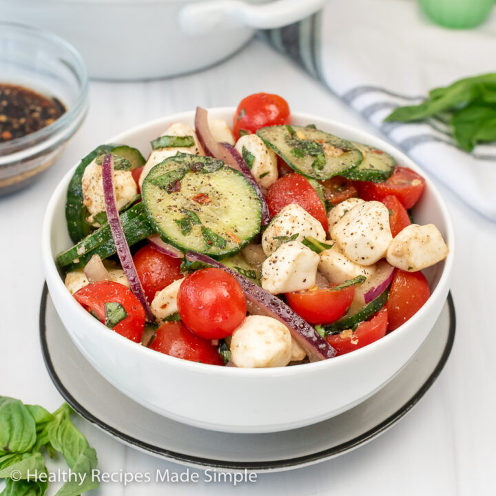 White bowl filled with fresh vegetables.