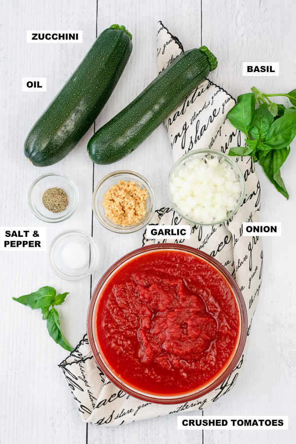 An overhead picture of ingredients for a zucchini noodle recipe.