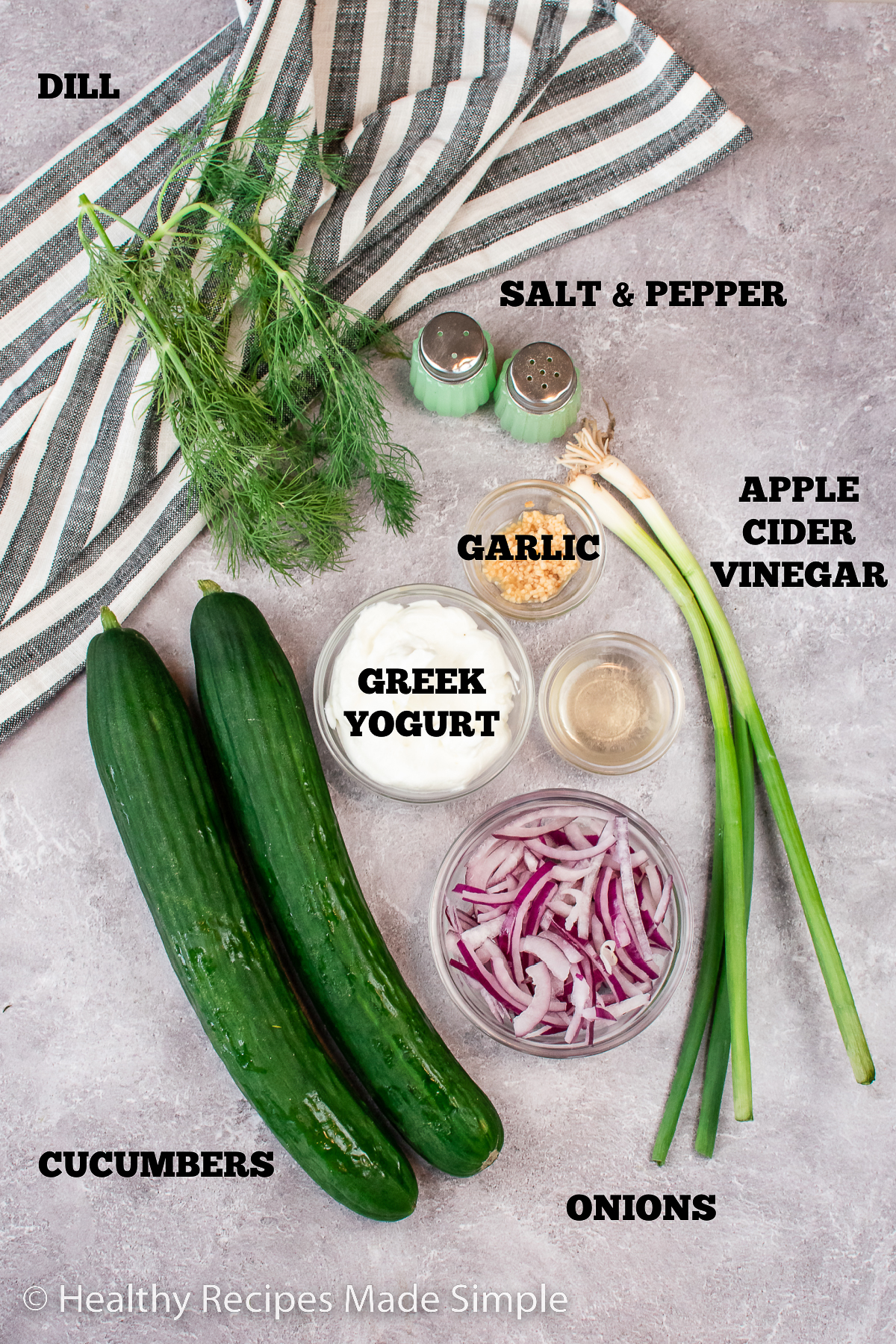 Ingredients needed for a cucumber salad with dill yogurt dressing.