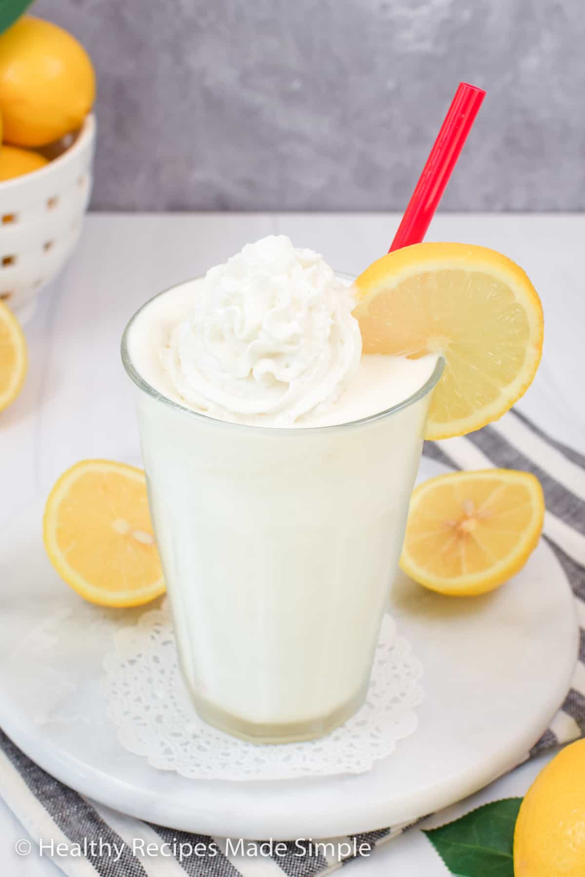 Frosted lemon shake with cream on top.