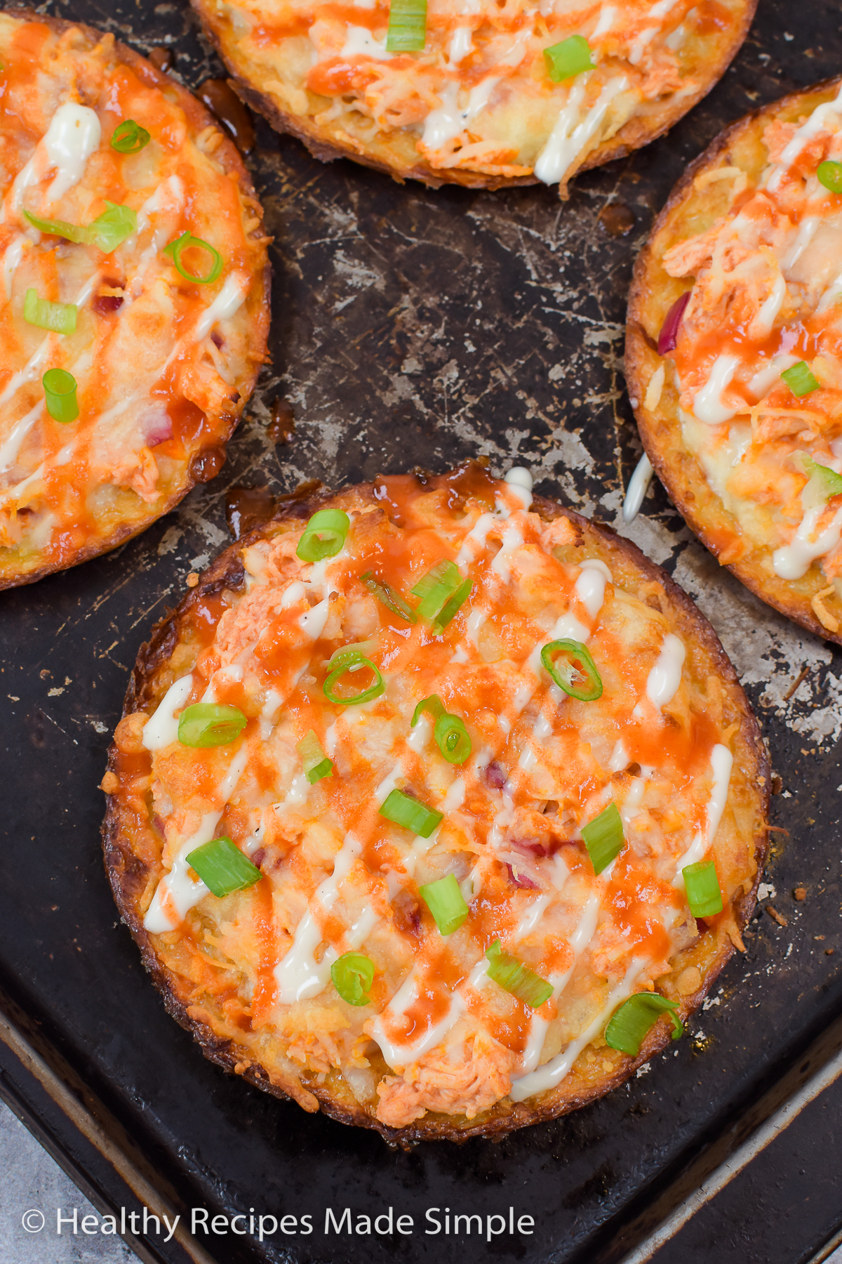 4 pizzas on a pan.