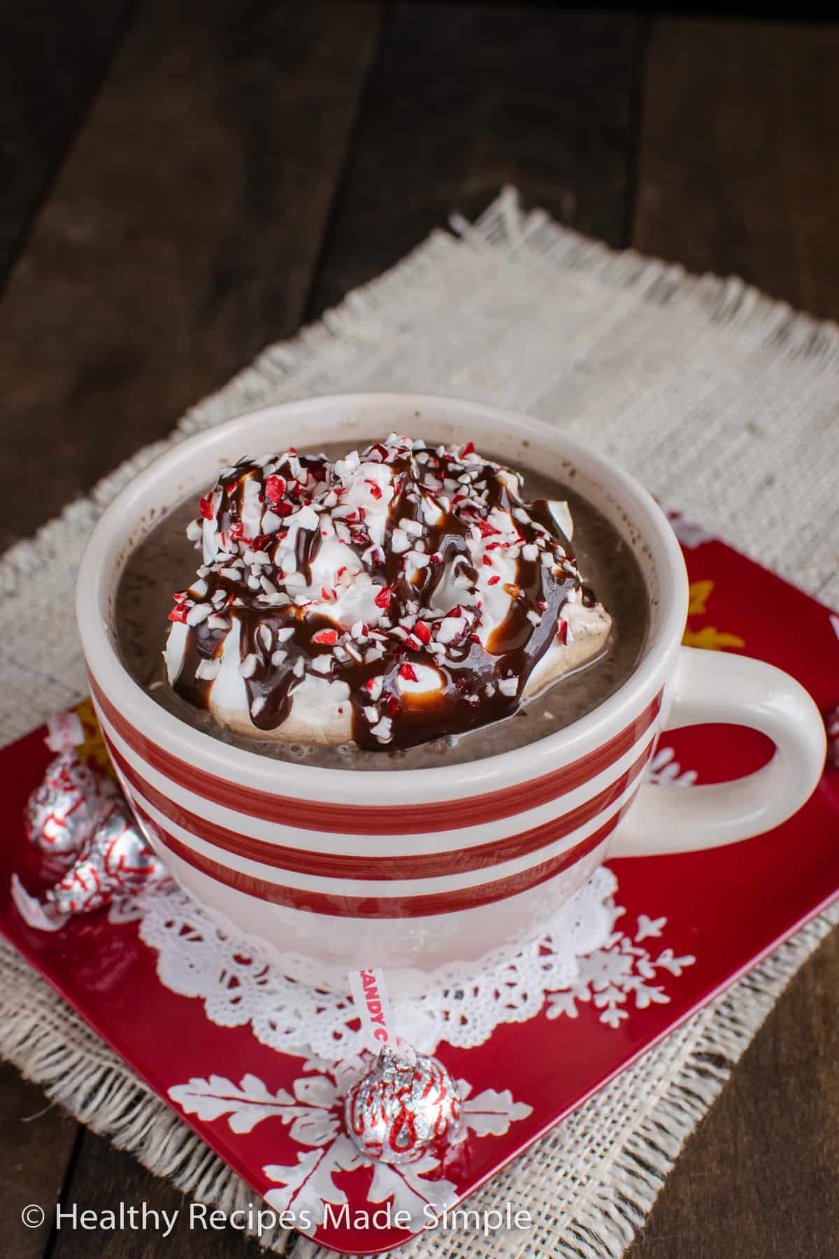 A white and red cup full of sugar free hot chocolate.