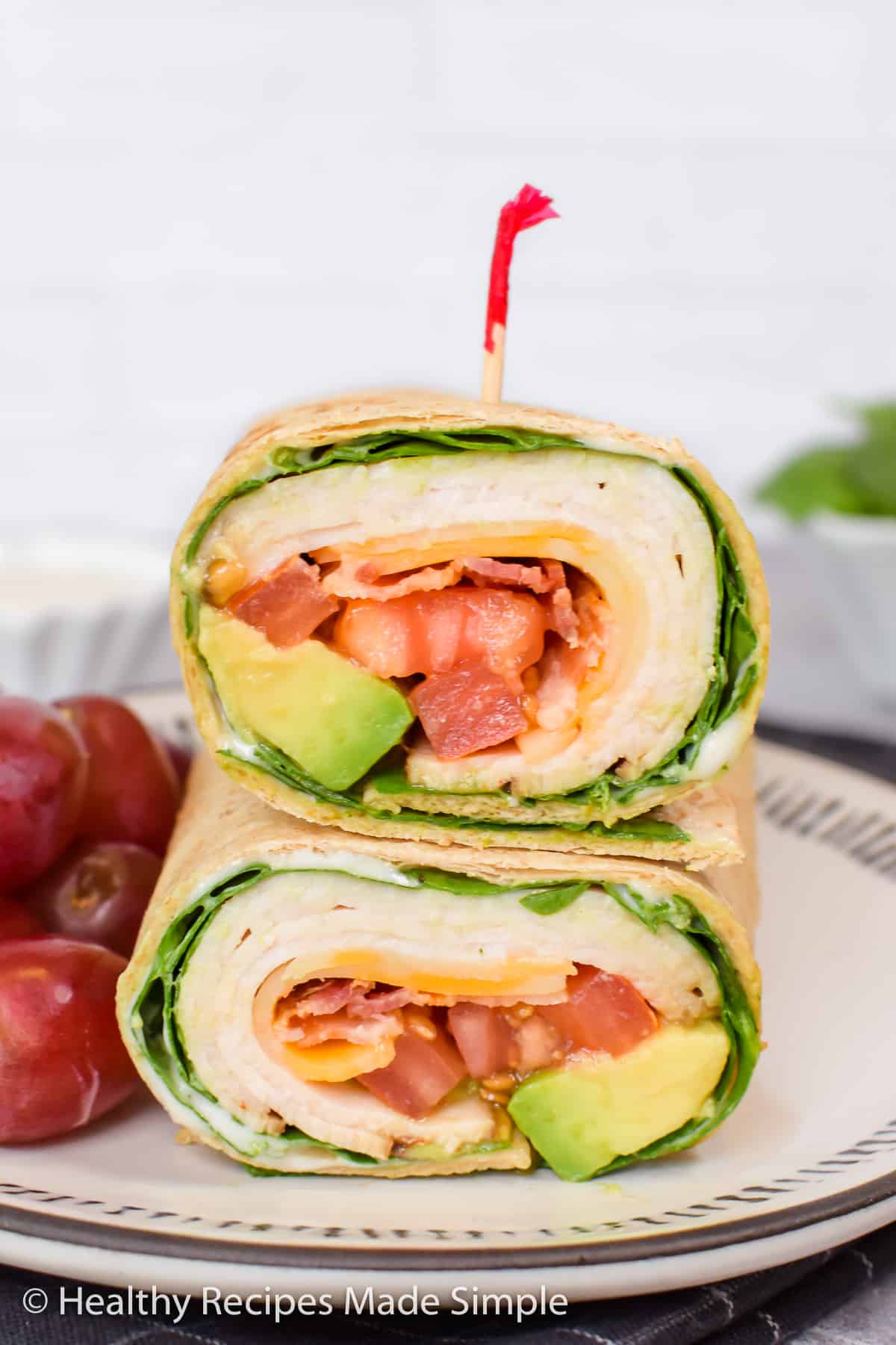 A low carb turkey wrap cut in half and placed on top of each other.
