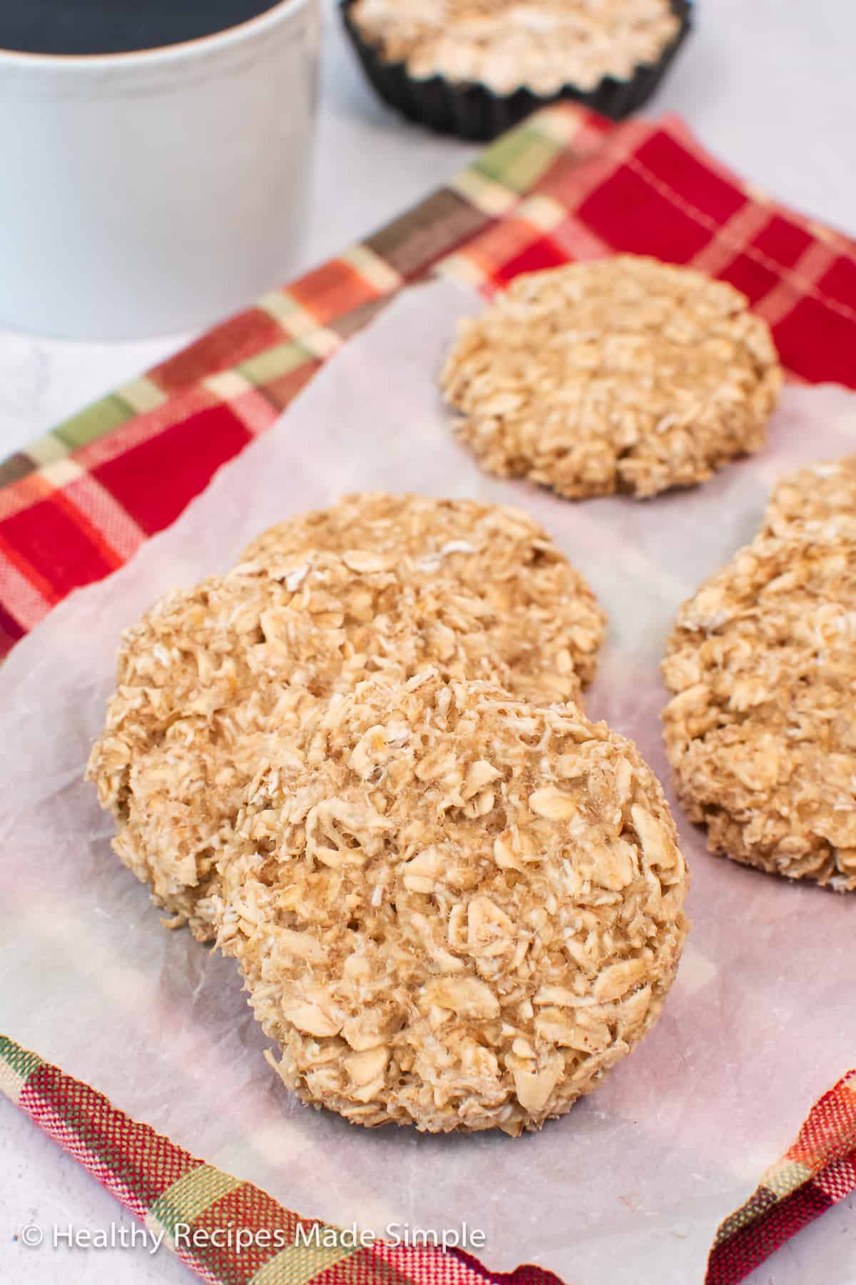 Oatmeal cookies on a piece of parchment paper.