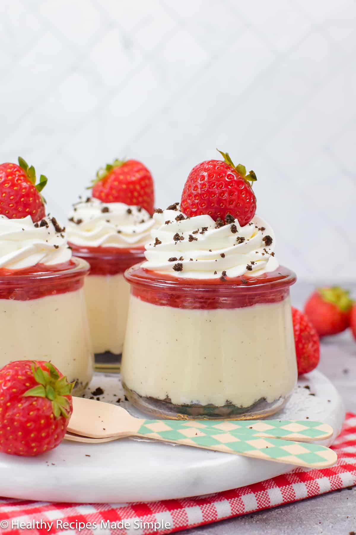 Pudding parfaits topped with whipped cream.